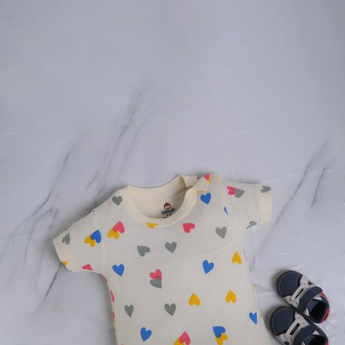 Cream Hearts Patterned Buttoned Romper